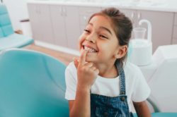 little girl showing her perfect smile pediatric dentist Jacksonville Florida
